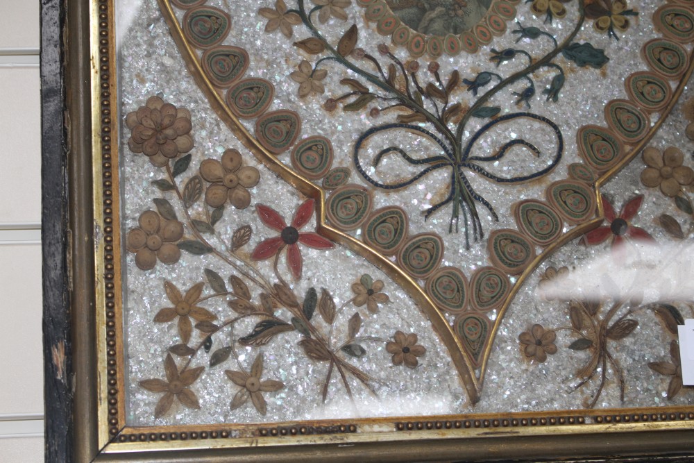 An early 19th century paper scroll work panel